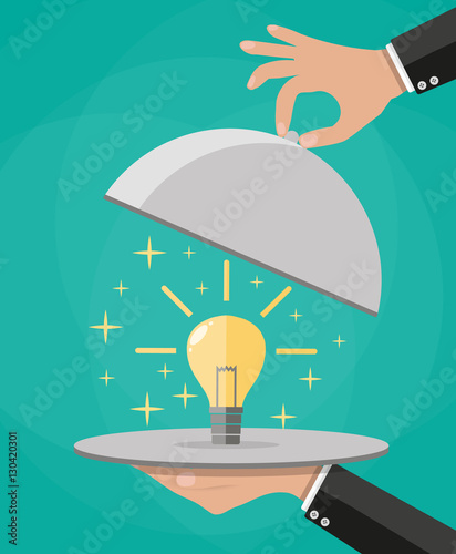 Hands holding platter cloche with idea light bulb