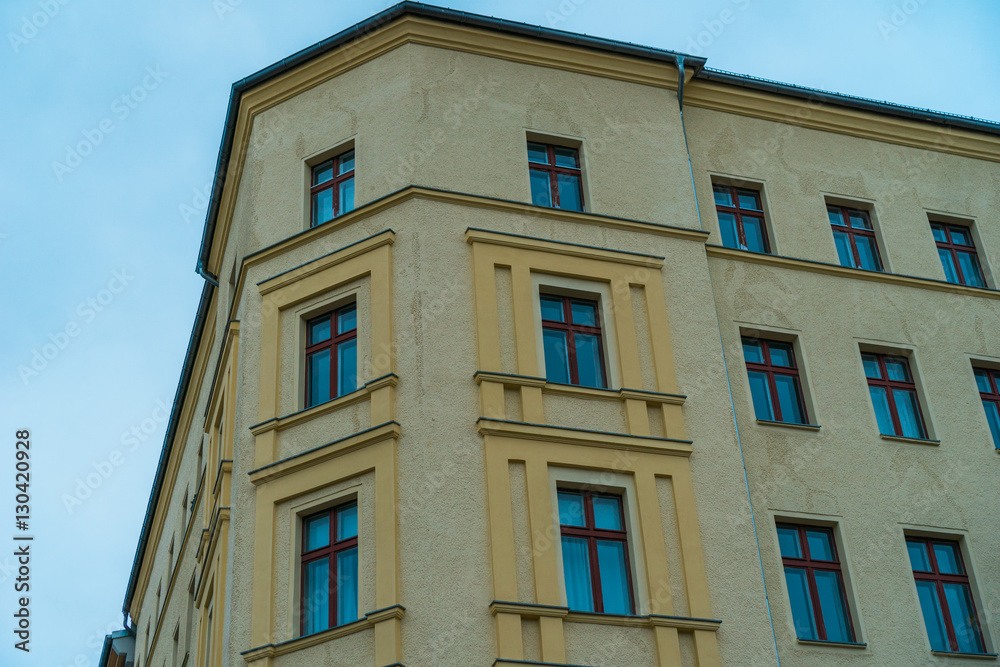 yellow corner house with blue windows yellow corner house with blue windows