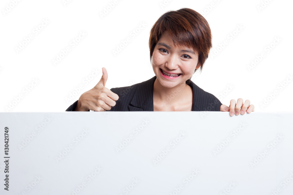 Young Asian woman show thumbs up with blank sign. Young Asian woman show thumbs up with blank sign.