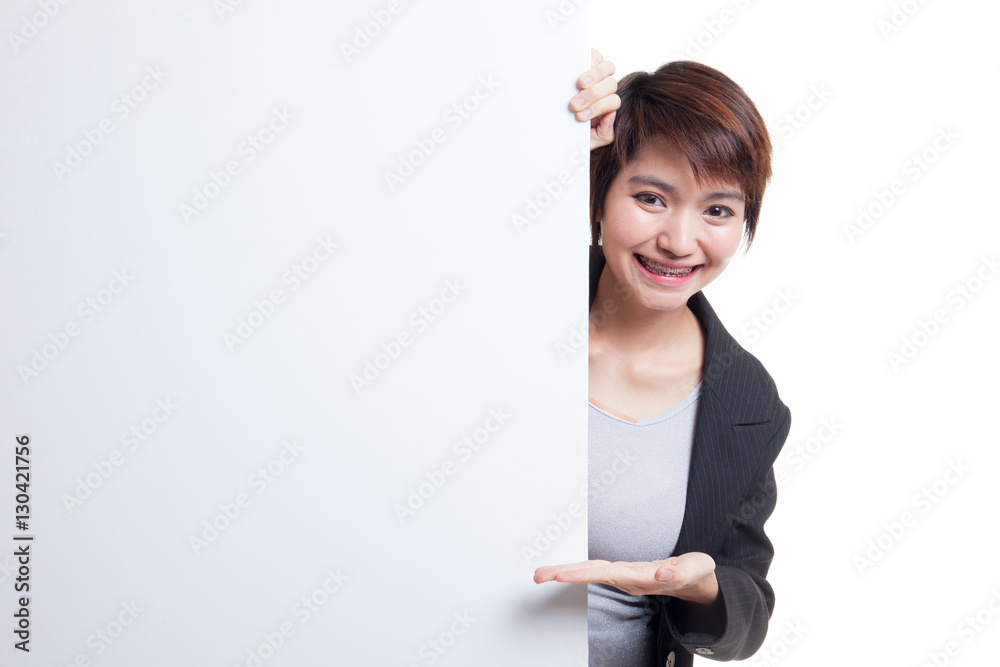 Young Asian woman present blank sign with palm hand. Young Asian woman present blank sign with palm hand.