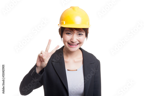 Asian engineer woman show Victory sign.