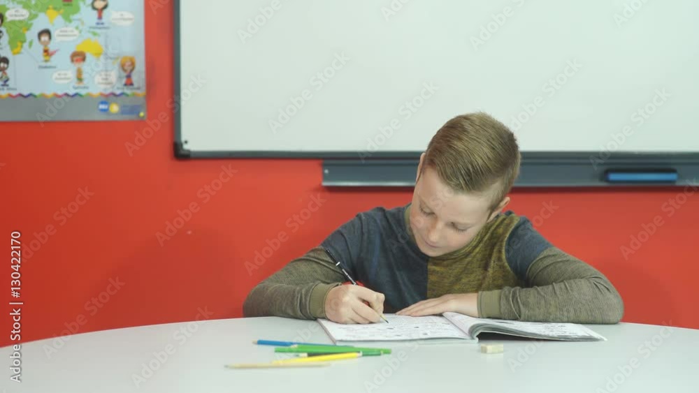 Tired boy doesn't want to do homework Tired boy doesn't want to do homework