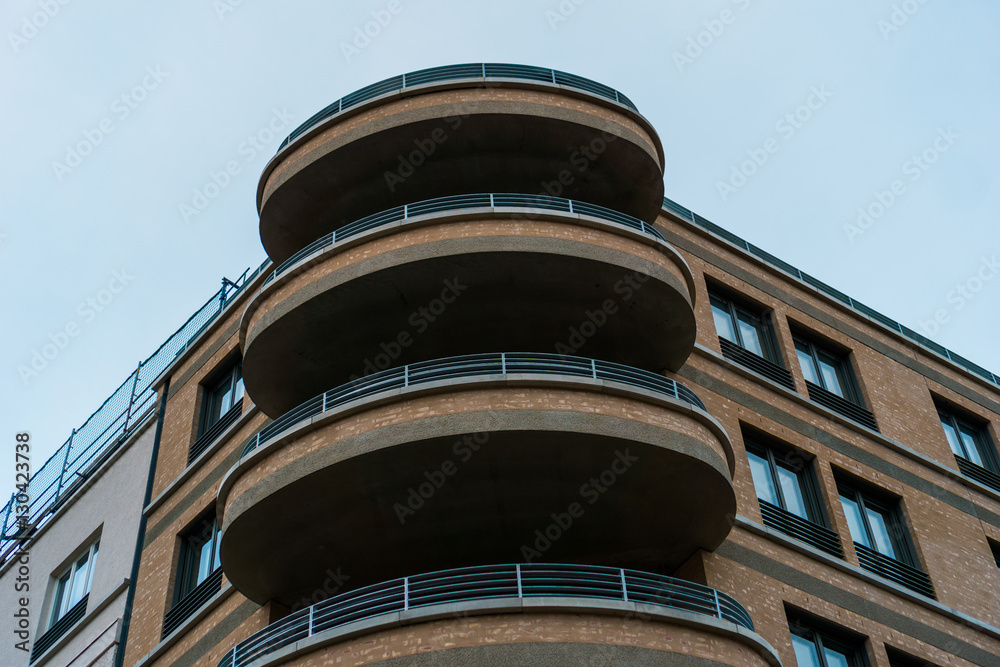 round balconies on brown brick building