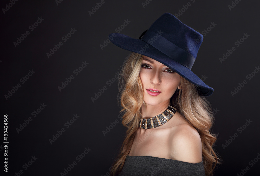Glamour sexy makeup blond long hair woman posing in fashion hat Glamour sexy makeup blond long hair woman posing in fashion hat