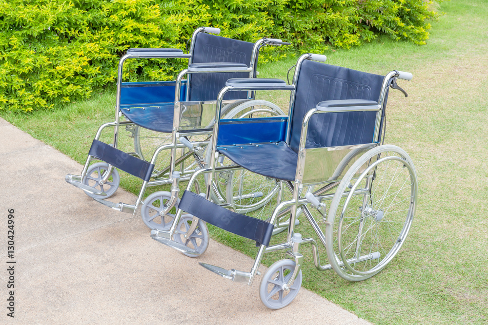 Empty wheelchairs service in the public park. Empty wheelchairs service in the public park.