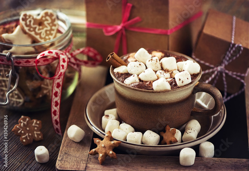 Hot cacao drink with marshmallows, gift box and christmas cookie