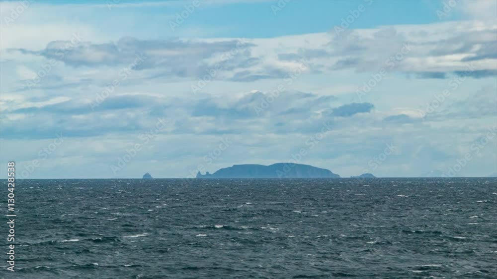 Chilean Fjords Land Formations on Ocean Horizon While Cruising at Sea during a South America Voyage Around the Horn Chilean Fjords Land Formations on Ocean Horizon While Cruising at Sea during a South America Voyage Around the Horn