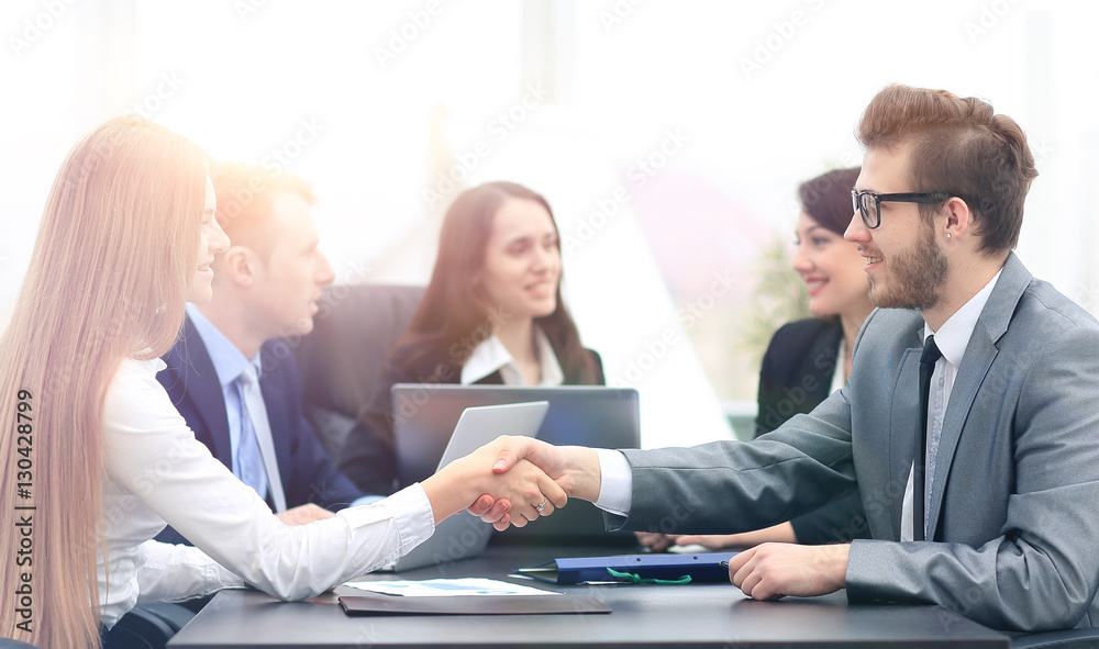 Two professional business people shaking hands Two professional business people shaking hands