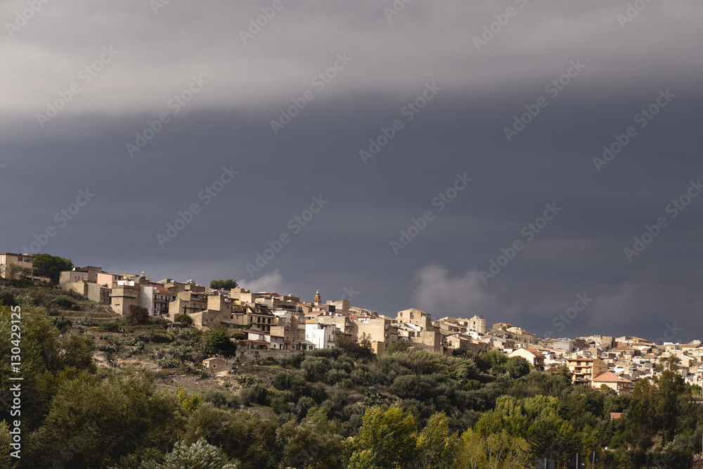 Postcard from Sicily, landscape view with heavy storm clouds