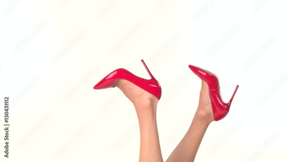 Isolated legs in heels. Women's glossy shoes. Look feminine and chic. Top quality branded footwear. Isolated legs in heels. Women's glossy shoes. Look feminine and chic. Top quality branded footwear.
