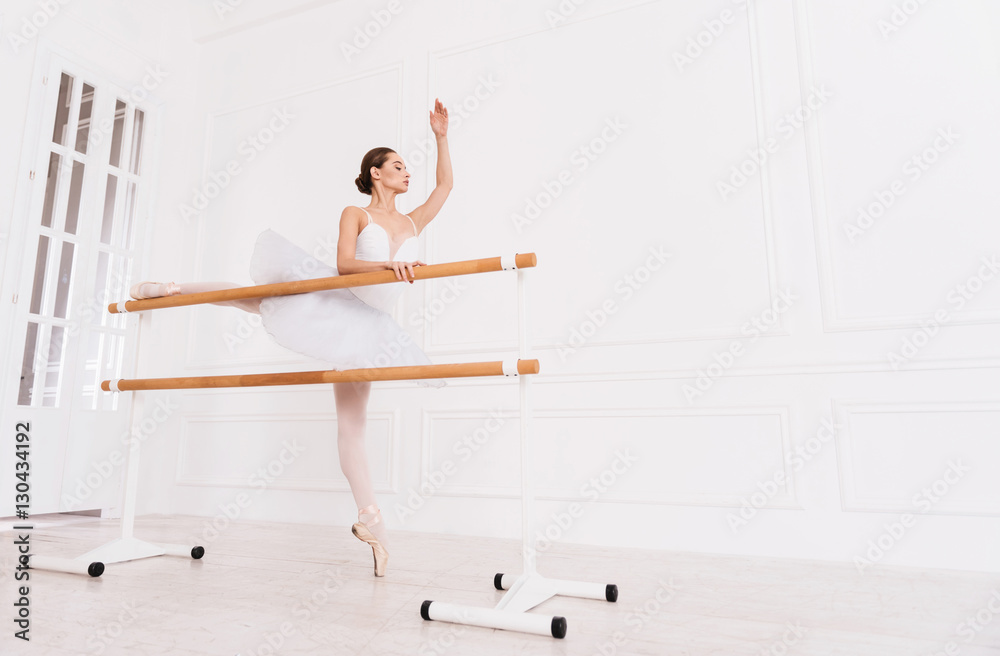 Side view of ballerina while training