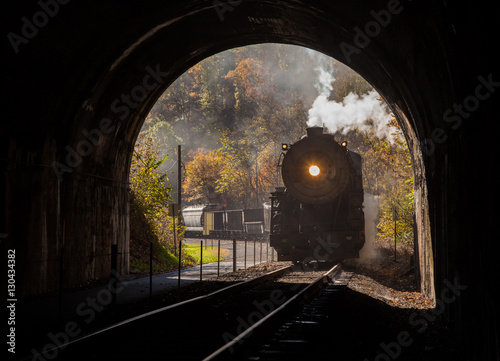 Steam locomotive enters tunnel