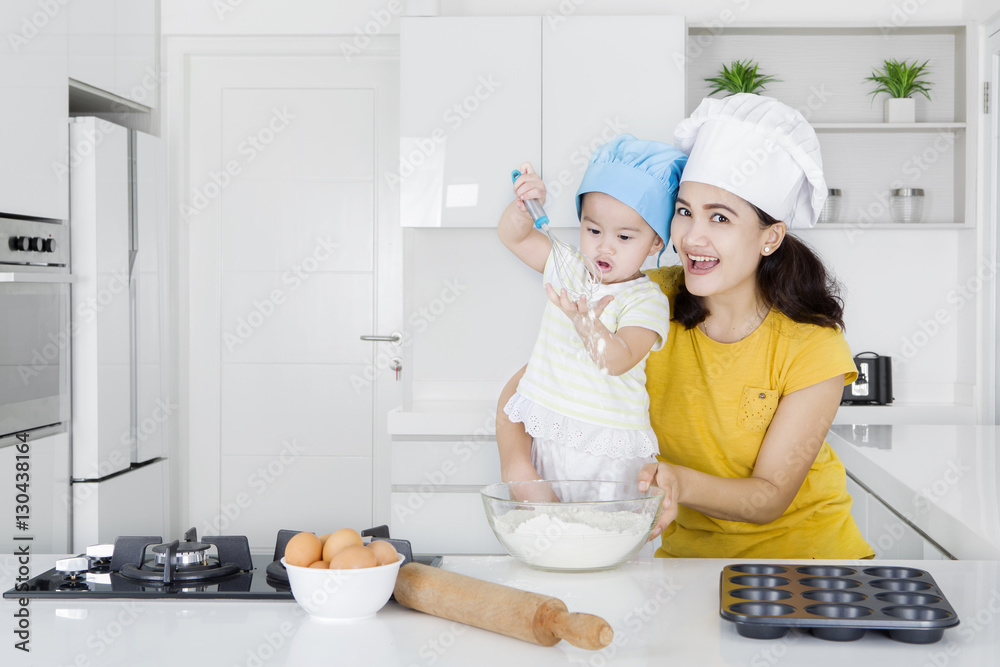 Mother and daughter cooking bakery together Mother and daughter cooking bakery together