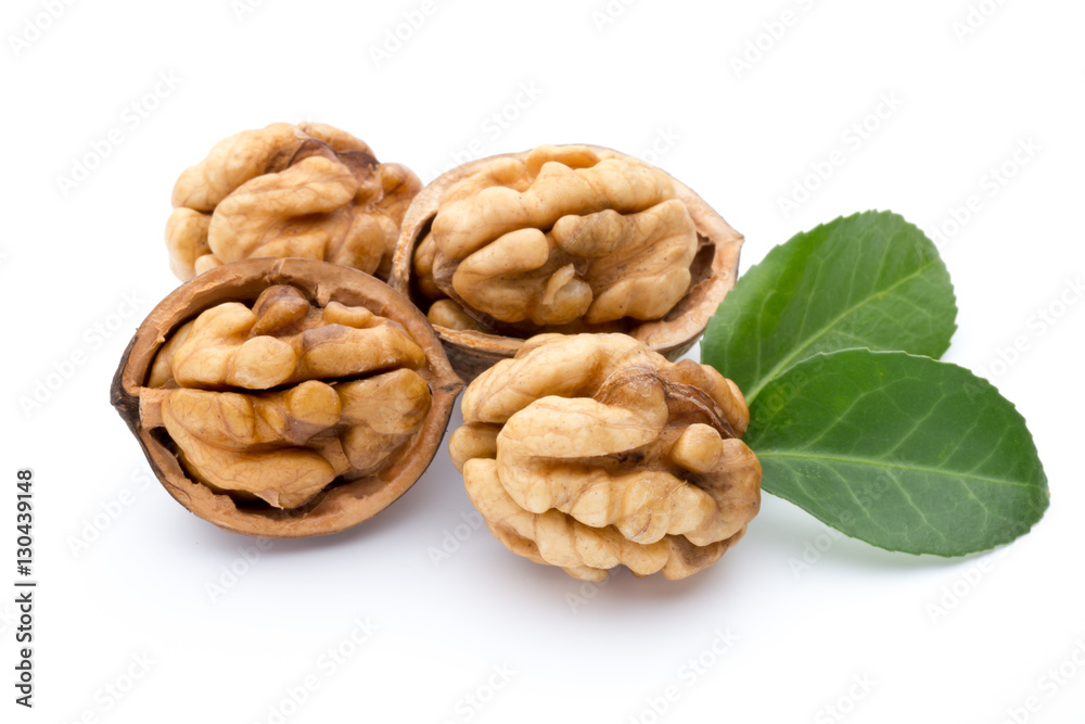 Walnut and walnut kernel isolated on the white background. Walnut and walnut kernel isolated on the white background.