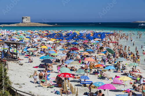 Tourists and beach umbrellas at La Pelosa Beach, Stintino, Asinara National Park, Province of Sassari, Sardinia