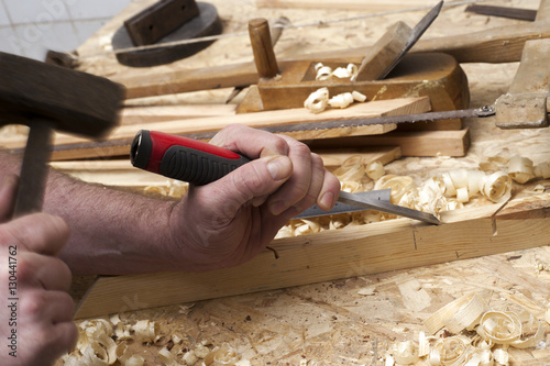 carpenter working,hammer,meter and screw-driver on construction