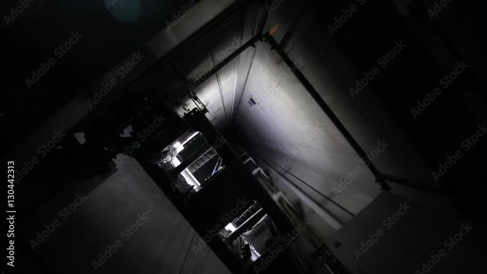 Elevator going up at speed on the elevator shaft