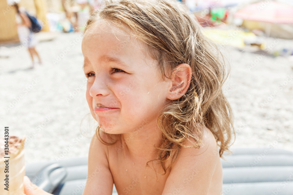 Fototapeta premium Little boy eating an ice cream