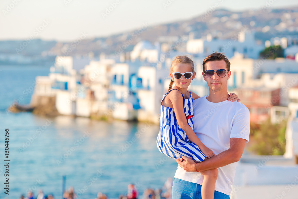 Family in Europe. Father and little girl background Little Venice in Mykonos