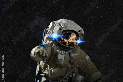 Photo Spaceman in space on the background of stars.