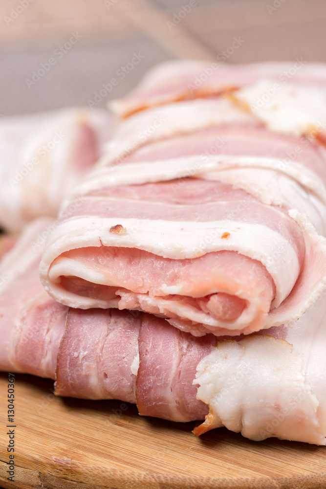 Closeup macro view stuffed meat with yellow cheese in bacon Closeup macro view stuffed meat with yellow cheese in bacon