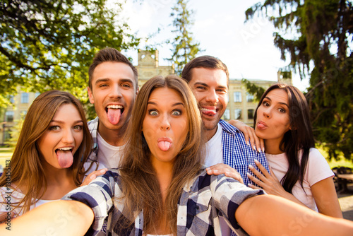 five crazy best friends fooling around and making selfie photo w