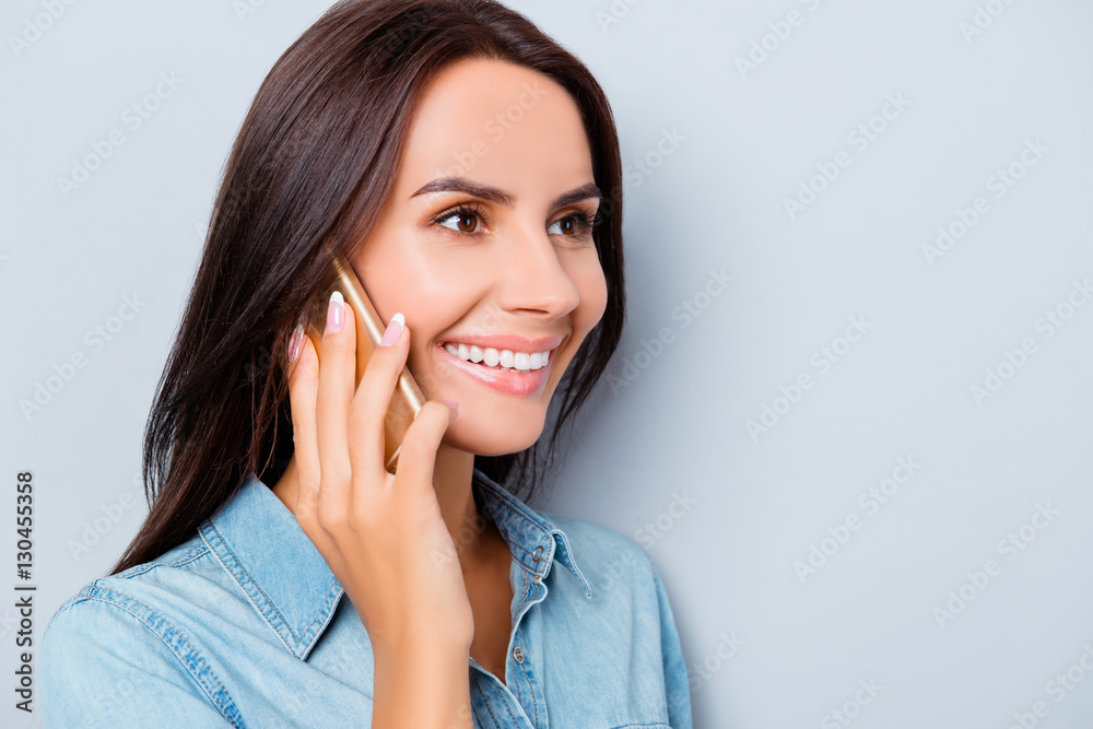 Portrait of beautiful cheerful woman talking on mobile phone Portrait of beautiful cheerful woman talking on mobile phone