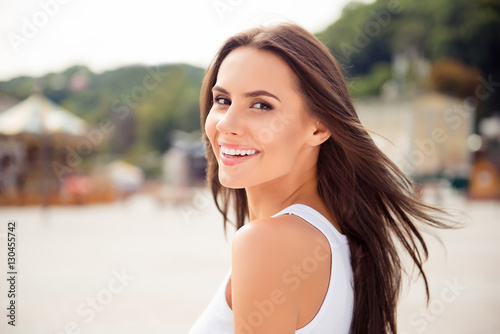 Portrait of beautiful smiling woman  on the background of the ci