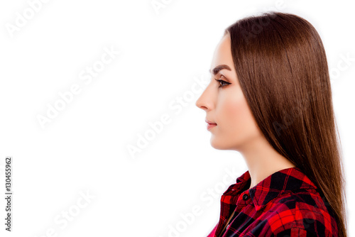Side view of young confident woman isolated on white background