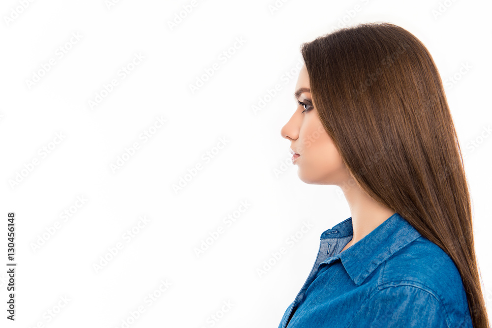 Profile of young pretty confident brunette woman in jean shirt Profile of young pretty confident brunette woman in jean shirt