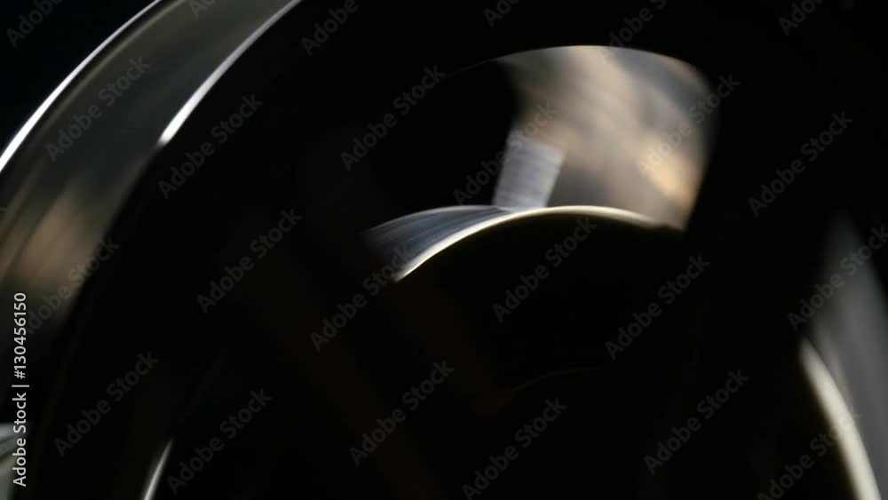  antique projector reel in a dark room, close up