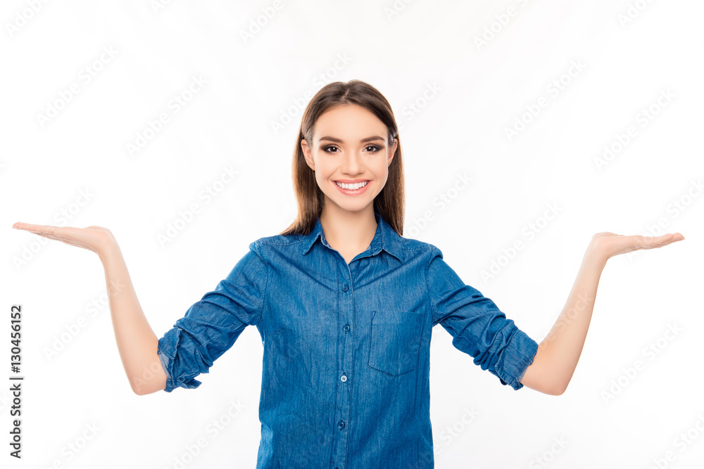 Pretty woman with beaming smile showing balance with both hands Pretty woman with beaming smile showing balance with both hands