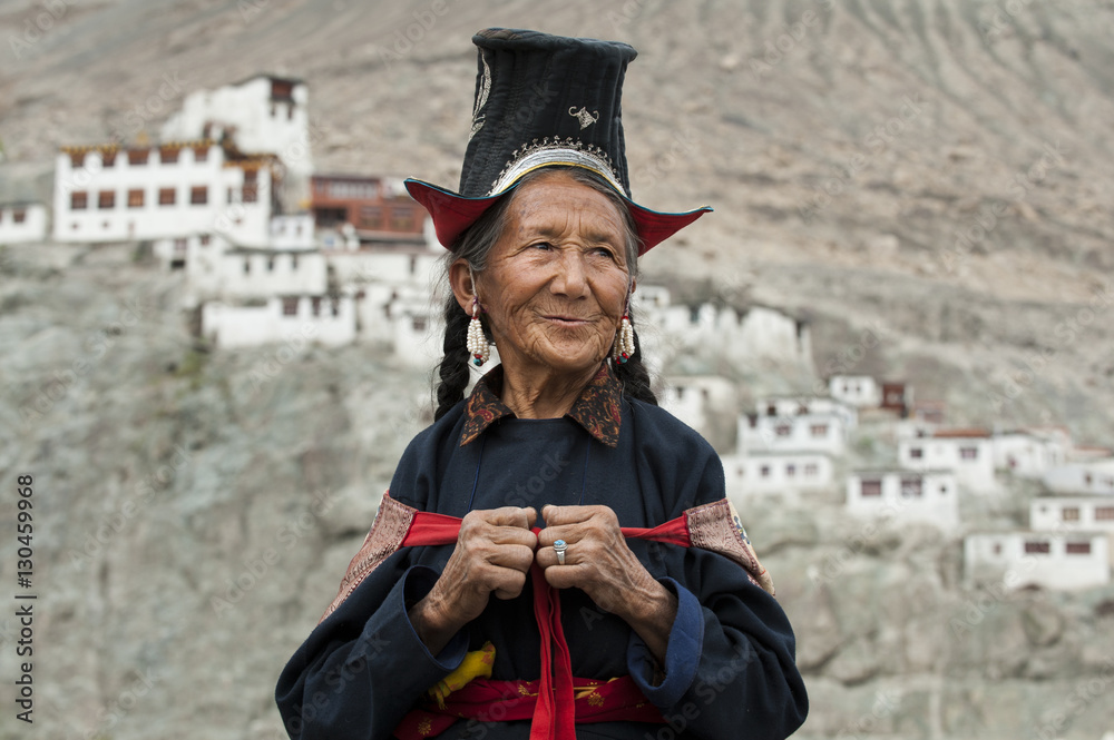 A Nubra woman wears traditional dress to attend a gathering at a local