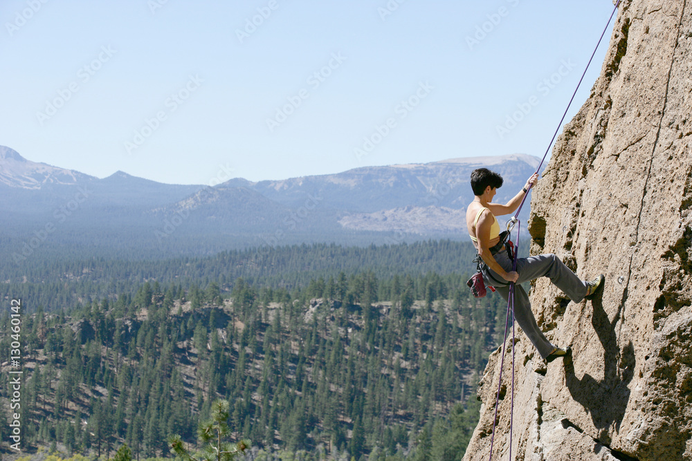 Fotografija Female Climber Rappelling