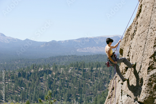 Картината върху платно Female Climber Rappelling