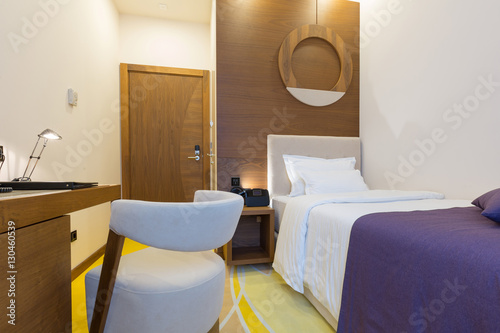 Single bed hotel room interior