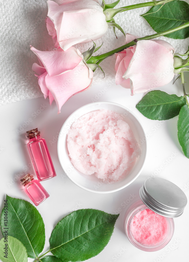 organic cosmetic with rose oil on white background top view organic cosmetic with rose oil on white background top view