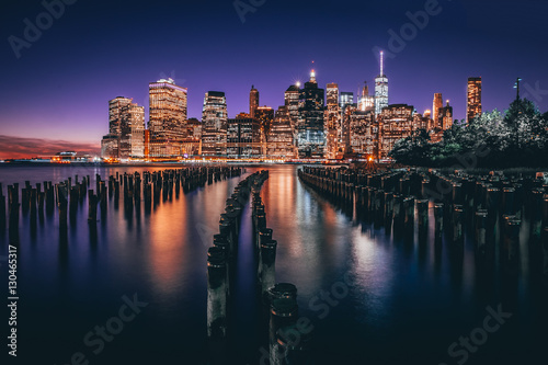 Lower Manhattan skyline night view from Brooklyn Bridge Park in New York City.