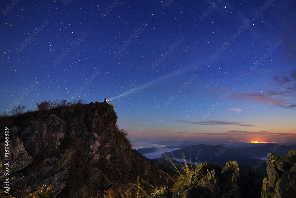 Beautiful scenery of the starry sky at night at Doi Pha Phung at Nan province in Thailand. Long exposure shooting and high iso used make this photo have noise - obrazy, fototapety, plakaty 