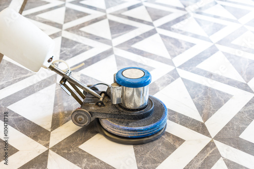 working polisher on marble floor photo