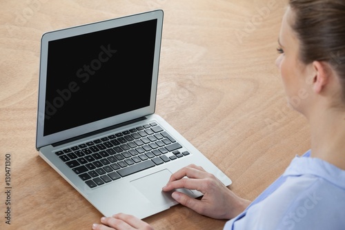 Businesswoman using laptop