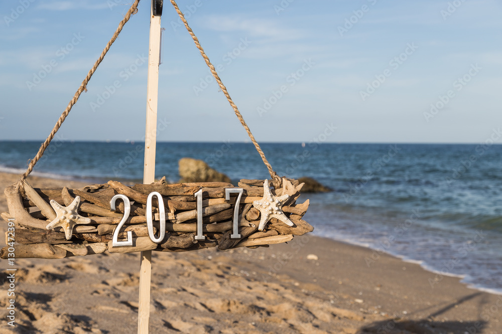 2017and starfish/metal 2017 number and starfish on the driftwood at the beach 2017and starfish/metal 2017 number and starfish on the driftwood at the beach