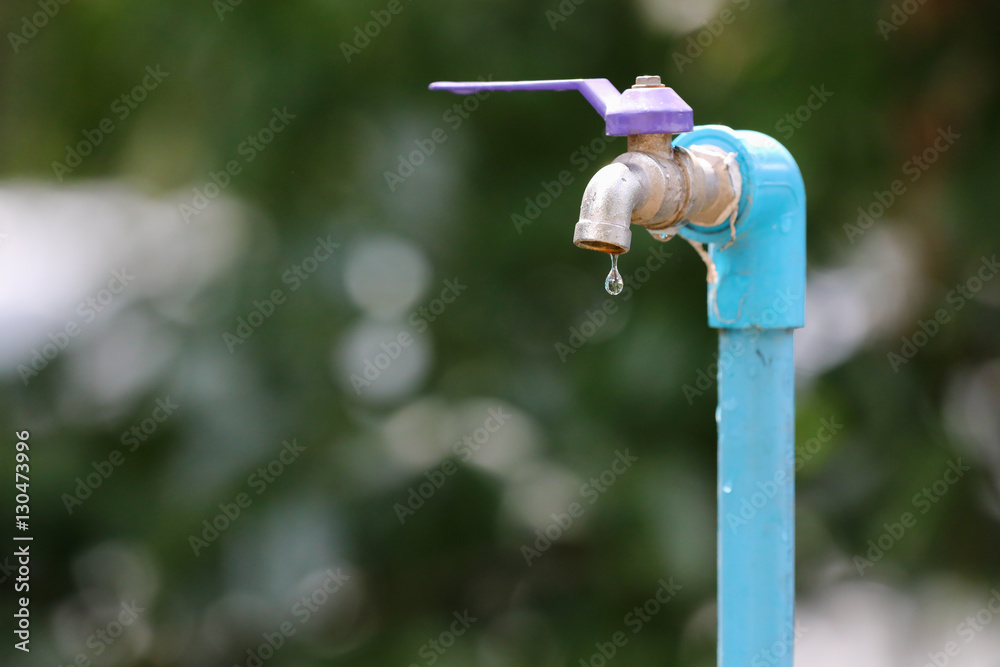 a dripping water faucet a dripping water faucet