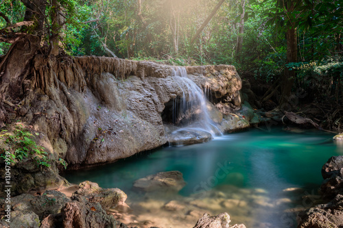 Waterfall hauy mae kamin water falls in deep forest Kanchanaburi western of Thailand photo