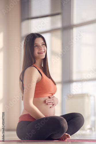 smiling fitness Pregnant woman sitting Free Download smiling fitness Pregnant woman sitting - GFXLoad