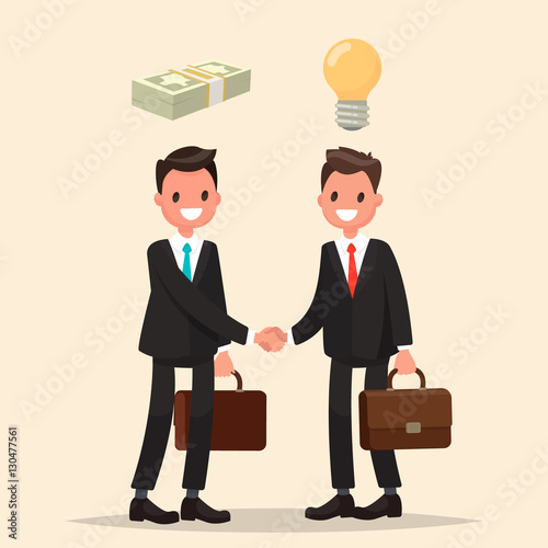 Concept of investment in the business. Two businessmen shake han