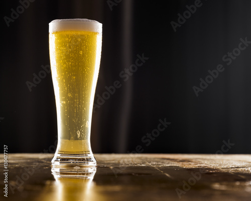 Tall glass of pilsner beer photo