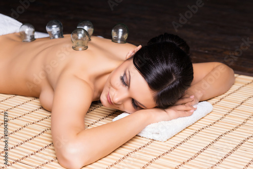 Young woman relaxing on a spa massage procedure