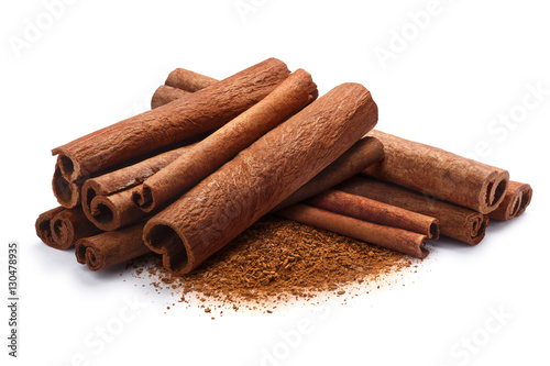 Fotografie Pile of cinnamon in sticks and ground, paths
