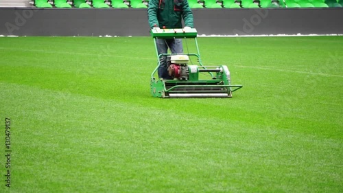 Mowing grass in a football stadium